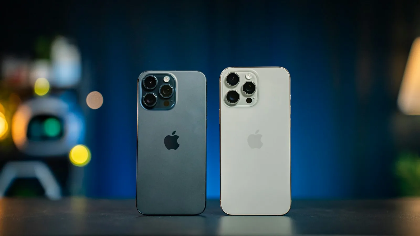 Two iPhone 16 Pro phones standing on a table